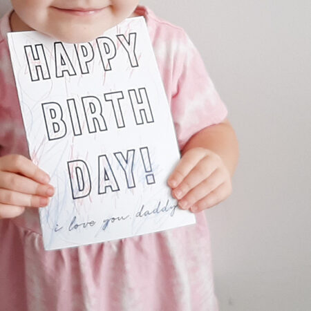 little girl holding the free printable card